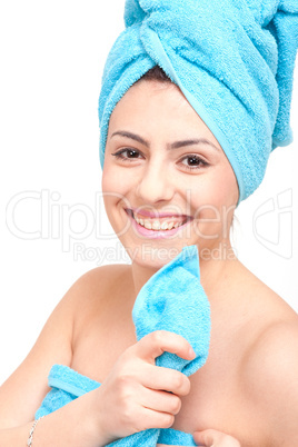 young beautiful woman with a towel doing wellness