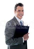 Businessman holding clipboard
