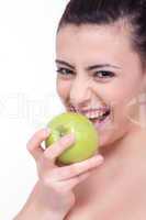 beautiful young brunette girl with a green apple