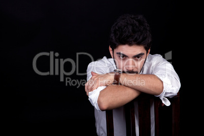 young successful business man with a suit isolated on black background