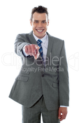 Portrait of businessman pointing at you