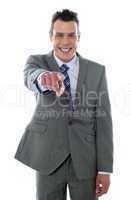 Portrait of businessman pointing at you