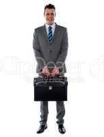 Comany's CEO holding his handbag