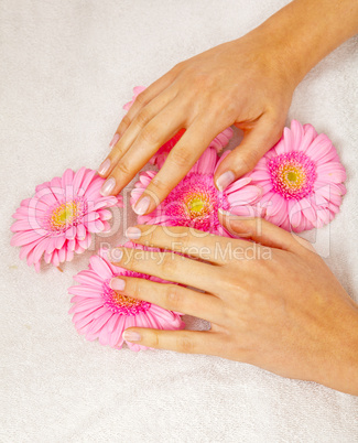 feminin hands with a treatment doing a manicure closeup