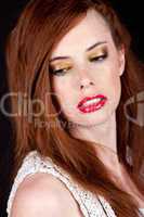 portrait of a beautiful young woman with red hair and red lips