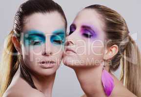 young beautiful woman with an extreme colorfull make up portrait