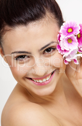 young beautiful brunette woman with flower