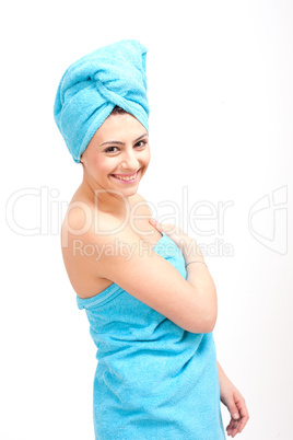 young beautiful woman with a towel doing wellness