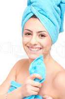 young beautiful woman with a towel doing wellness