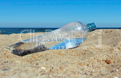 Water bottle on sand