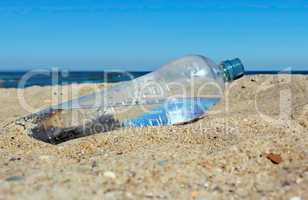 Water bottle on sand