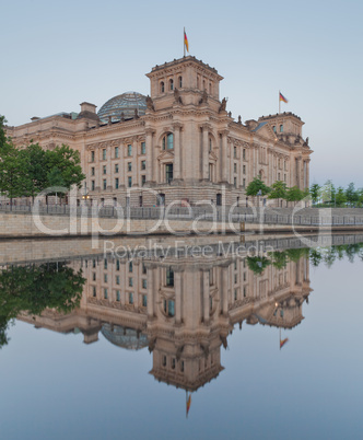 The Reichstag building (Bundestag), famous landmark in Berlin and housing the German Government with spree reflection