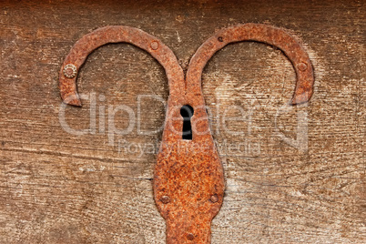 Detail of old chest with rusty iron plate