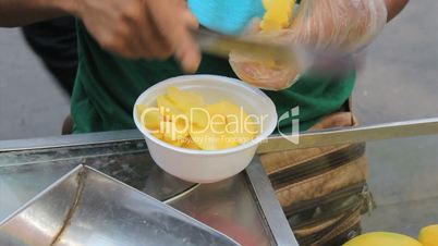 Street Vendor Cutting Fresh Mango