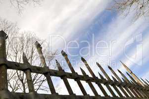 Metal fence against the spring sky