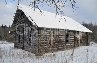 Old broken house in winter