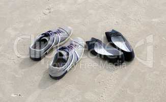 Shoes on beach sand