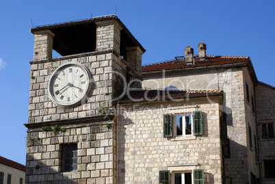 Clock tower and house