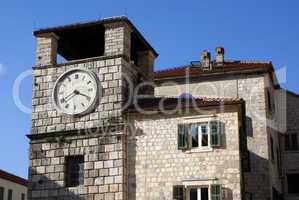 Clock tower and house