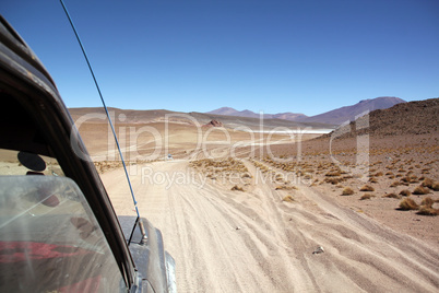 Cars on the desert road