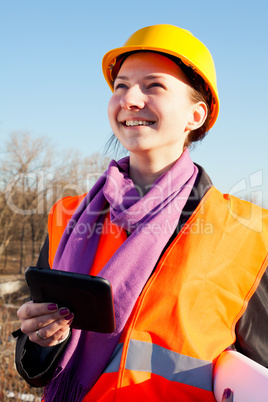 Young lady architect staying outdoors