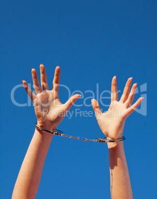 Handcuffed woman's hands