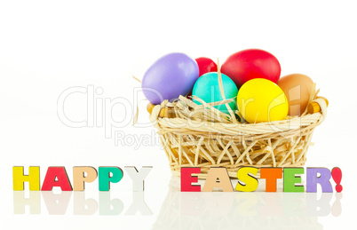 Basket with the colorful Easter eggs