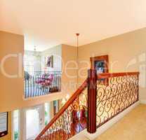 Luxury home hallway with metal railings.