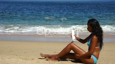 Young Latin Woman Using Sunscreen