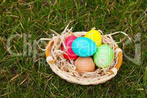 Basket with the colorful Easter eggs