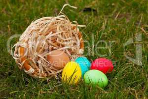 Basket with the colorful Easter eggs