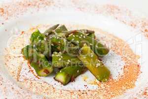 Fried Asparagus on white plate