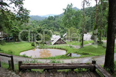 Wooden houses and pond