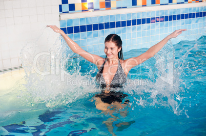 Attractive girl in swimming pool