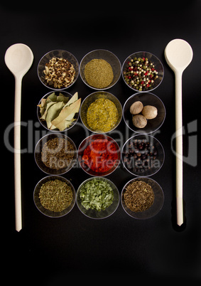 spices with wooden spoons