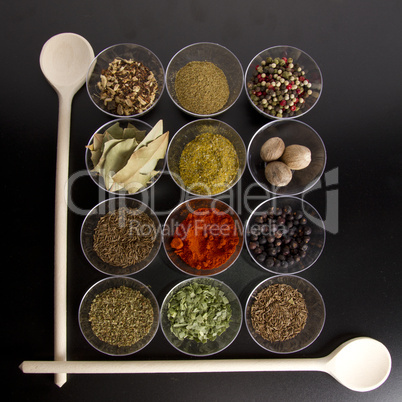 spices with wooden spoons