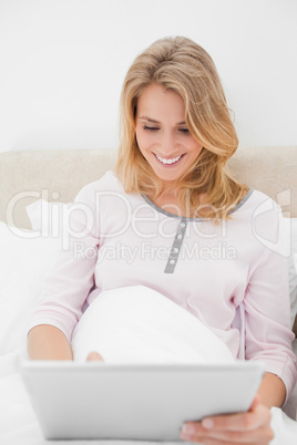 Close up, woman using a tablet pc while looking at the screen an