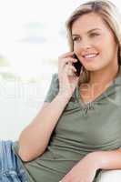 Close up, woman making a phone call, smiling and looking to the