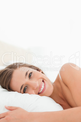 Close up, Woman in bed smiling brightly