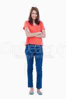 Teenager wearing casual clothes while crossing her arms