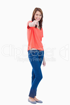 Teenager pointing to the camera with her finger