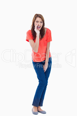 Teenager whispering against a white background