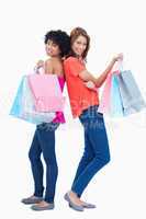 Two teenage girls holding shopping bags