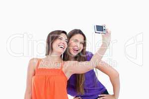 Two teenagers photographing themselves