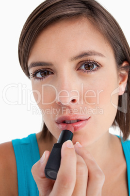 Young woman focused on making-up