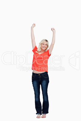 Teenager raising her arms above the head