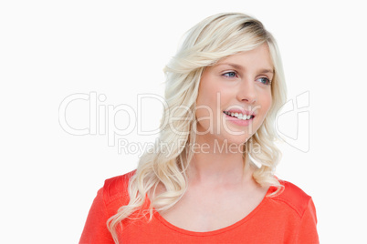 Woman smiling as she looks to the side