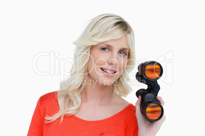 Beautiful woman holding a pair of binoculars