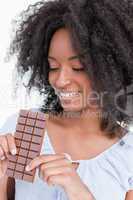 Young woman looking at a delicious chocolate bar