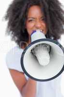Megaphone held by a young woman shouting